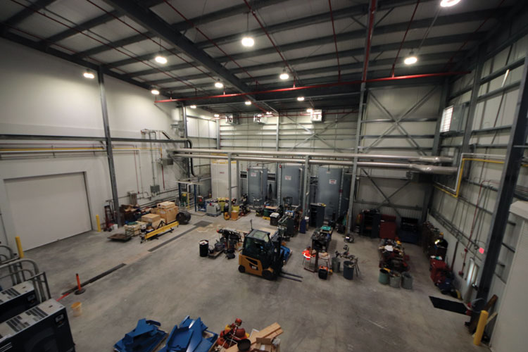 <b>The tank room and garage at CIPCO's Summit Lake site stores equipment and supplies of chemicals such as urea that help to reduce pollution from the generating station's trio of natural gas piston engines.</b> (CANCO photo) 